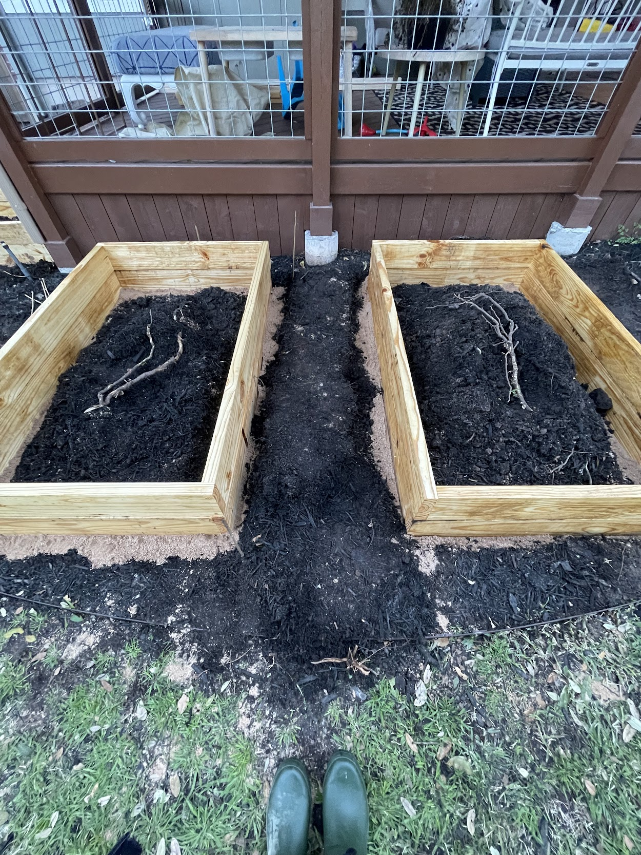 Raised beds sit waiting to be filled with organic material from the garden.